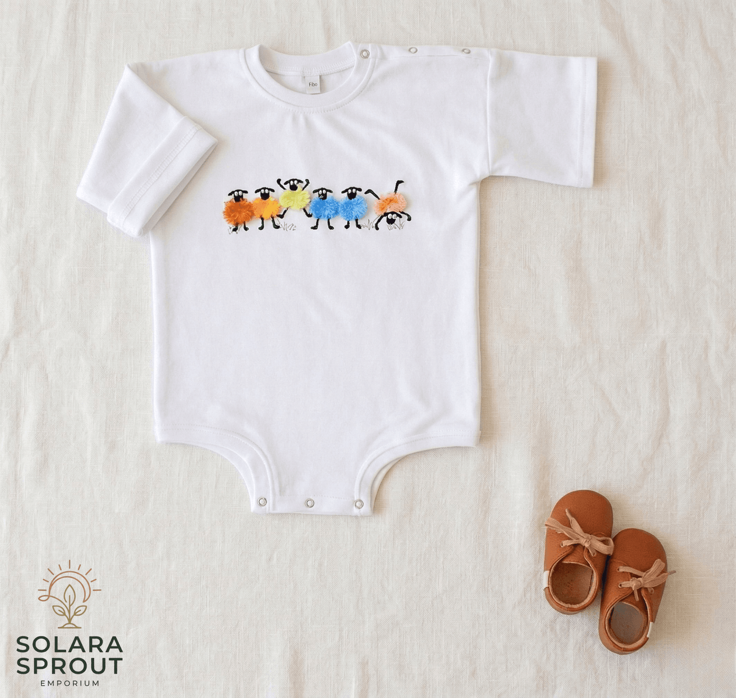 Sheep Baby Cotton Tee Romper Fringed Embroidery featuring colorful sheep design on a white background with baby shoes.