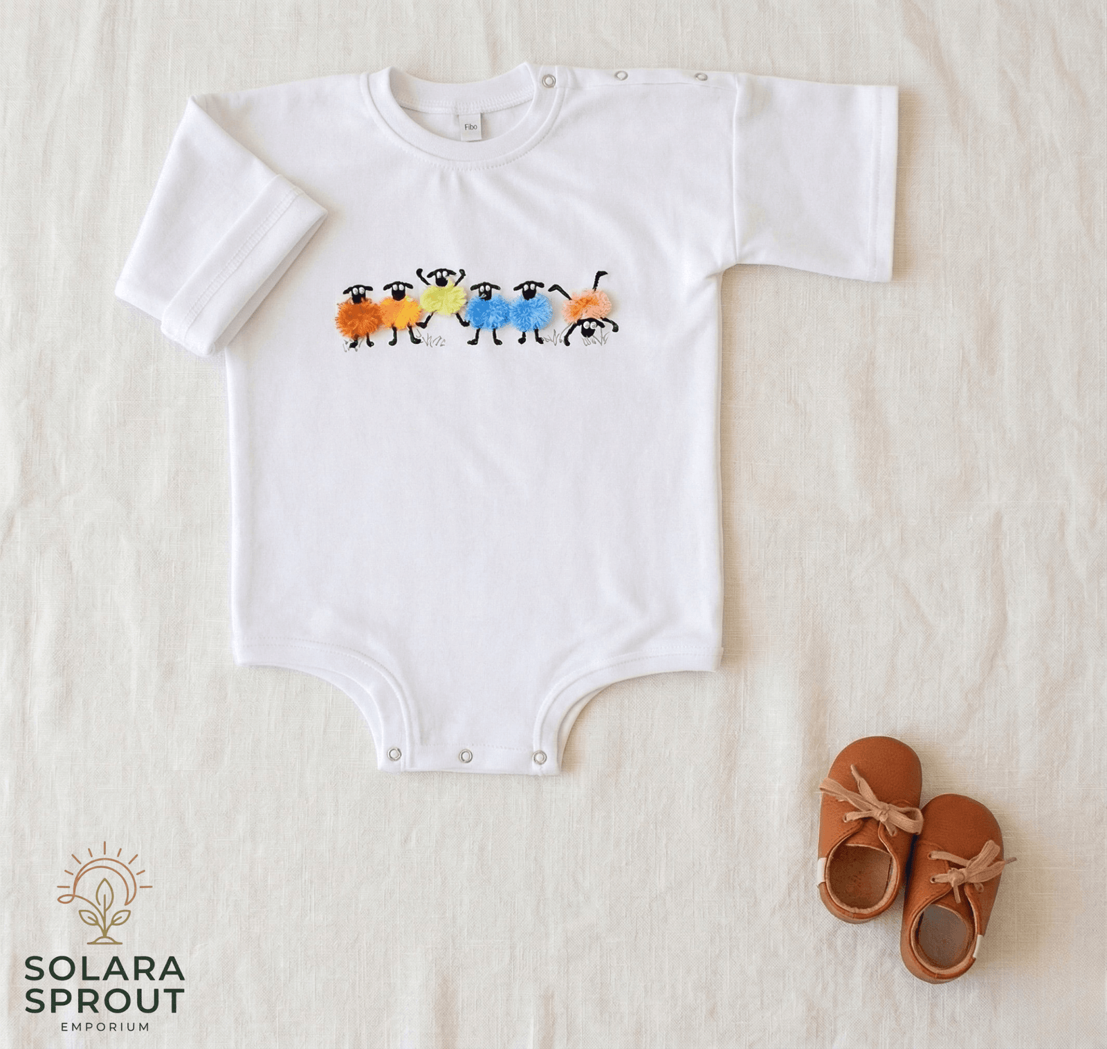 Sheep Baby Cotton Tee Romper Fringed Embroidery featuring colorful sheep design on a white background with baby shoes.